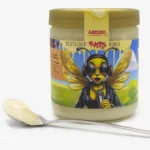 WEEZEL 500g Rapshonig Glas, mit einem Löffel voller Honig.